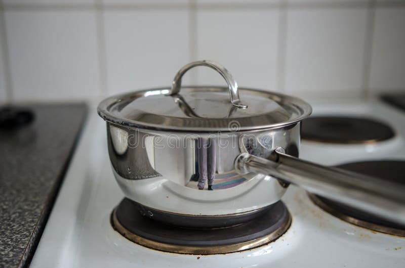 Kettle on stove stock image. Image of kitchenwear, metallic 39347671