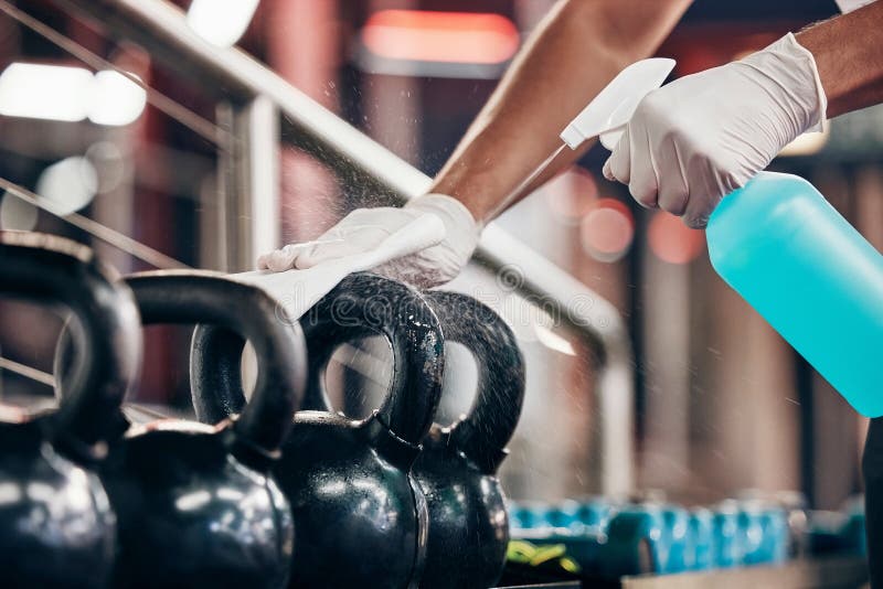 Kettlebell, Cleaning Service and Hands Cleaning at a Gym with Liquid ...