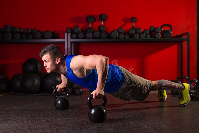Kettlebells push-up man strength gym workout royalty free stock photo