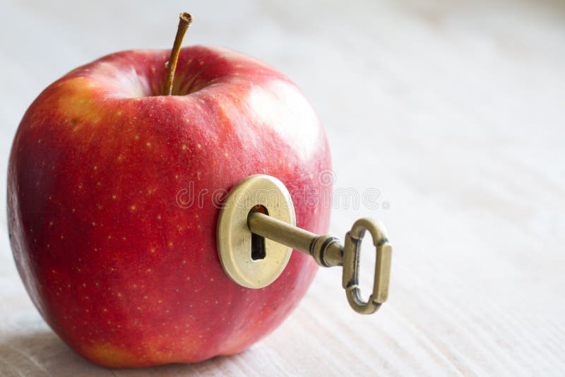 Key and apple, key to health. Healthy eating concept