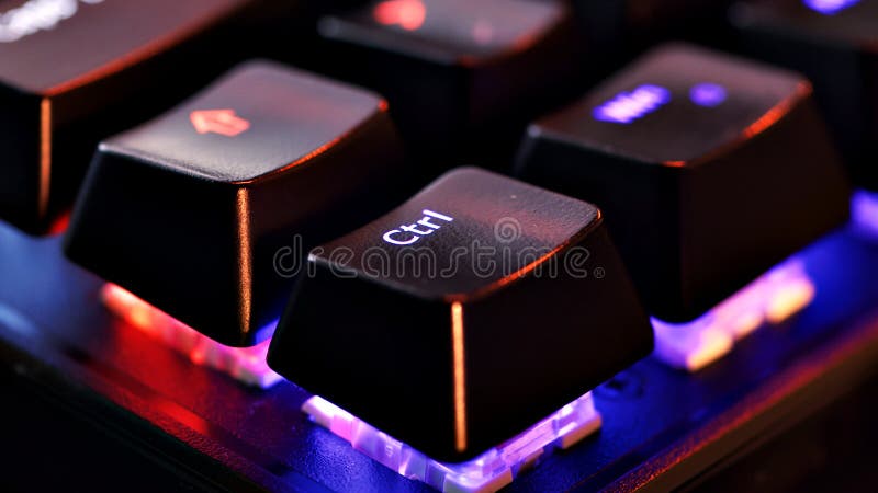 Keyboard key - Control - macro shot. Modern gaming keyboard close-up with beautiful color backlight. Macro shooting of the rgb computer keyboard with backlight. Low angle view with soft focus