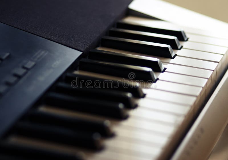 The keyboard synthesizer for performance of various musical parties stands royalty free stock image The keyboard synthesizer for performance of various musical parties stands royalty free stock image