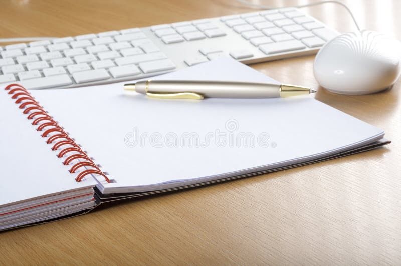 Keyboards, mouse and notebook royalty free stock image