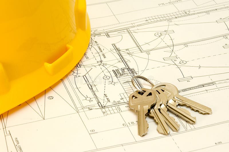Keys and hat over a construction plan stock images