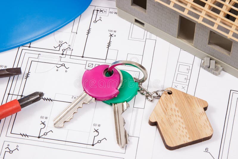Keys with Home Shape and Small House Under Construction with Electrical ...