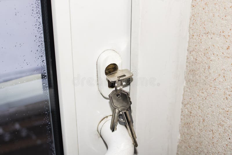 Keys in Lock of White Plastic Door Stock Image Image of lock
