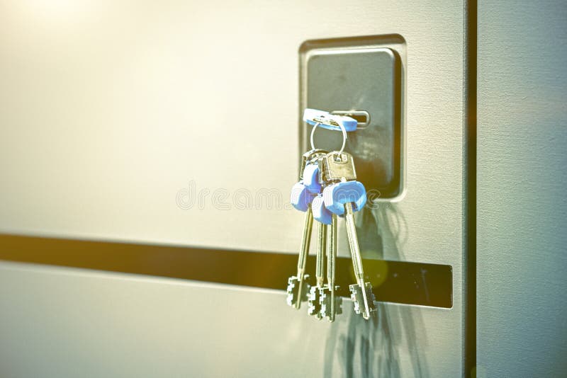 Keys Stuck in a Lock. Closeup Door Lock Keys, Real Estate Concept Door