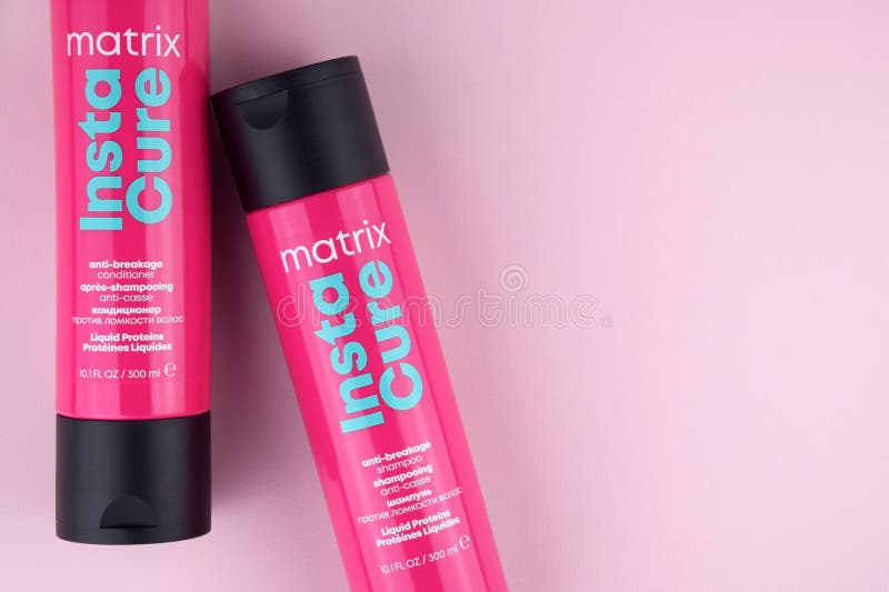 Matrix Insta Cure shampoo on the pink background royalty free stock photo