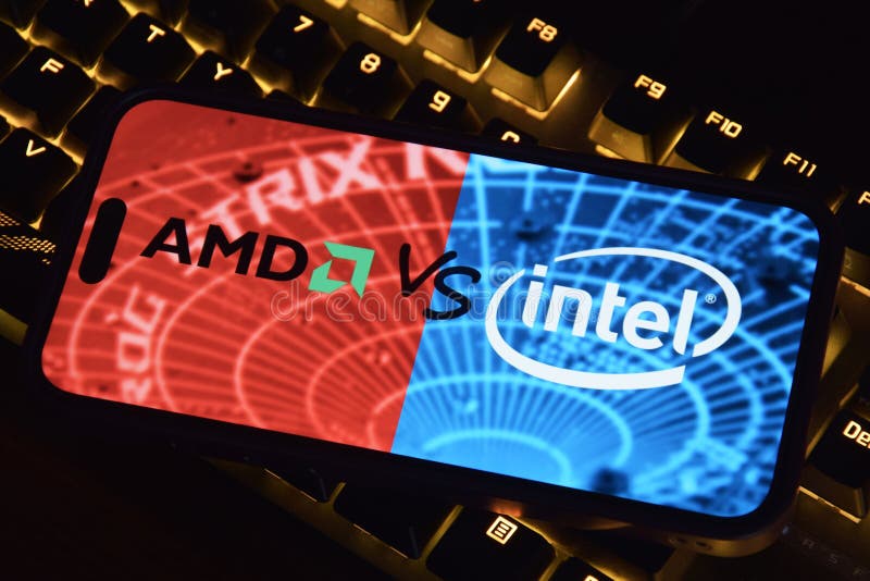 Phone with AMD and INTEL logo on computer background. royalty free stock photography