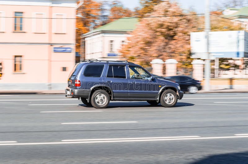 Kia Sportage SUV First Generation is Driving Along the Street in City with  Blurred Background. Side View Rolling Shot with Blue Editorial Photo -  Image of street, speeding: 240674796