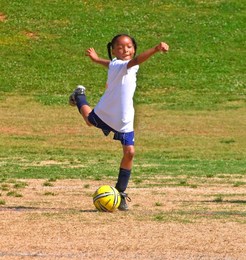 Woman Kicking Soccer Ball