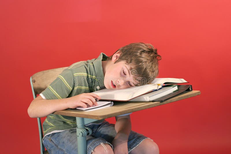 Kid asleep at his desk