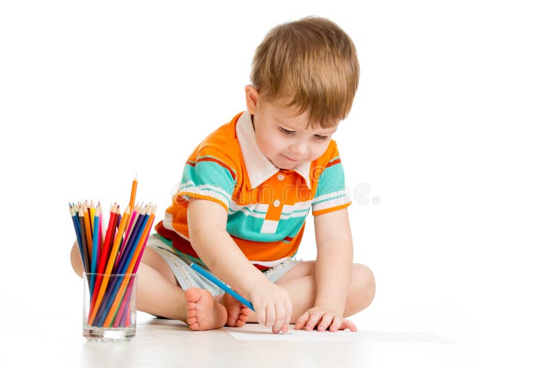 Kid boy drawing with colour pencils