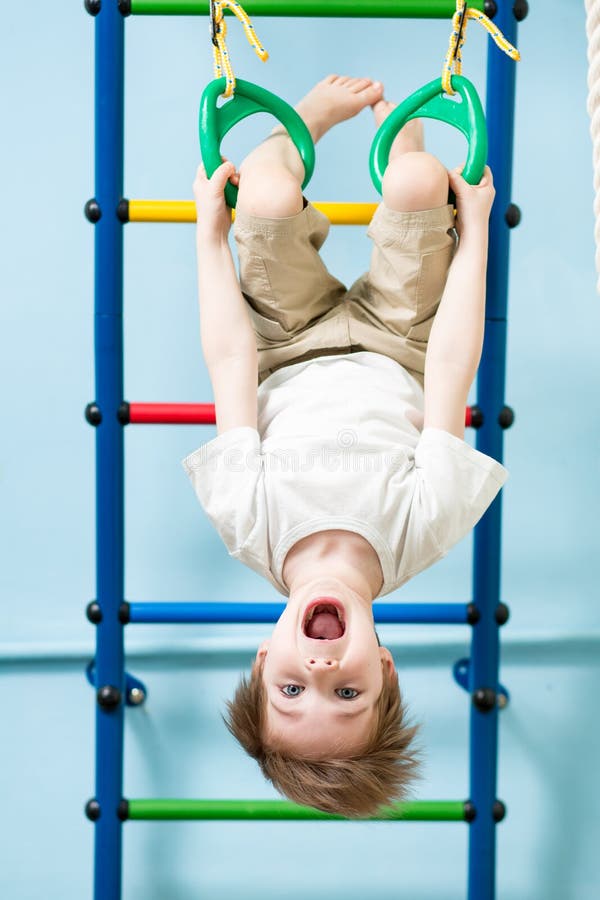 Kid Boy on the Gymnastic Rings in the Gym Class Stock Photo Image of