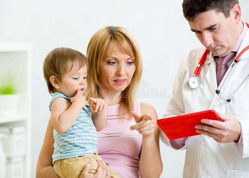 Kid boy in hospital at doctor having examination stock images Kid boy in hospital at doctor having examination stock images
