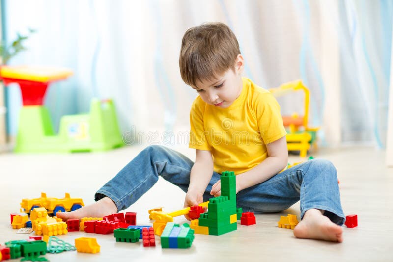 Kid boy playing with block toys at home stock image Kid boy playing with block toys at home stock image