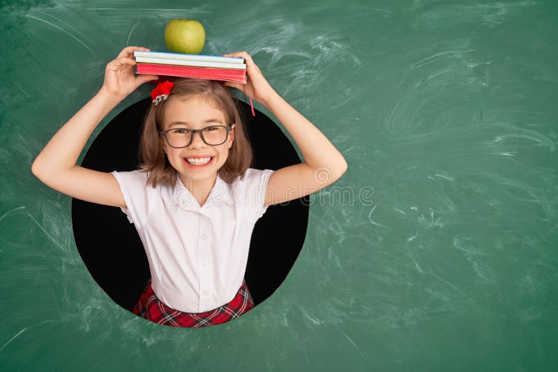 Kid in class on background of chalkboard royalty free stock photo Kid in class on background of chalkboard royalty free stock photo