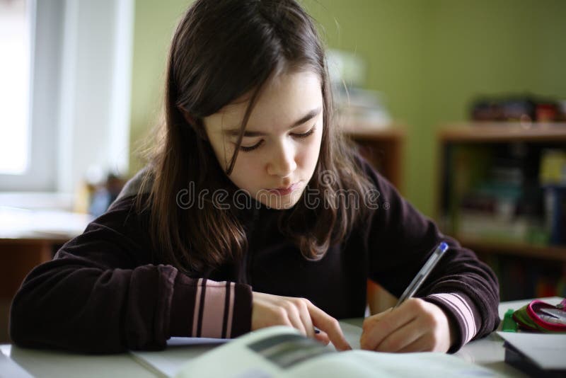 Kid doing homework stock image