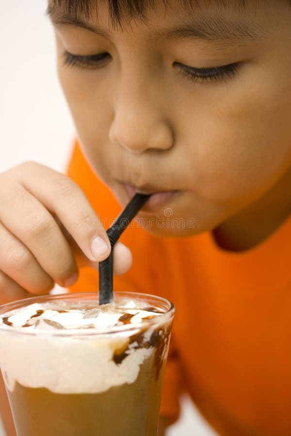 Kid drinking iced chocolate