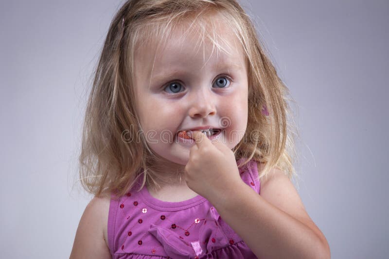 Kid eating gum stock photo. Image of daughter, fashion 15351738