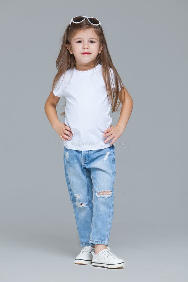 Kid Girl Preschooler in Blue Jeans, White T-shirt and Sunglasses is Posing Isolated Grey Background Stock - Image of active, emotions: 175709867