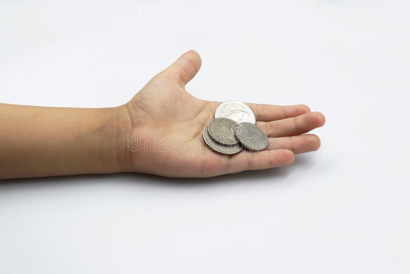 Kid hand showing money coins , child holding a coins on his hand isolate on white background royalty free stock photography Kid hand showing money coins , child holding a coins on his hand isolate on white background royalty free stock photography