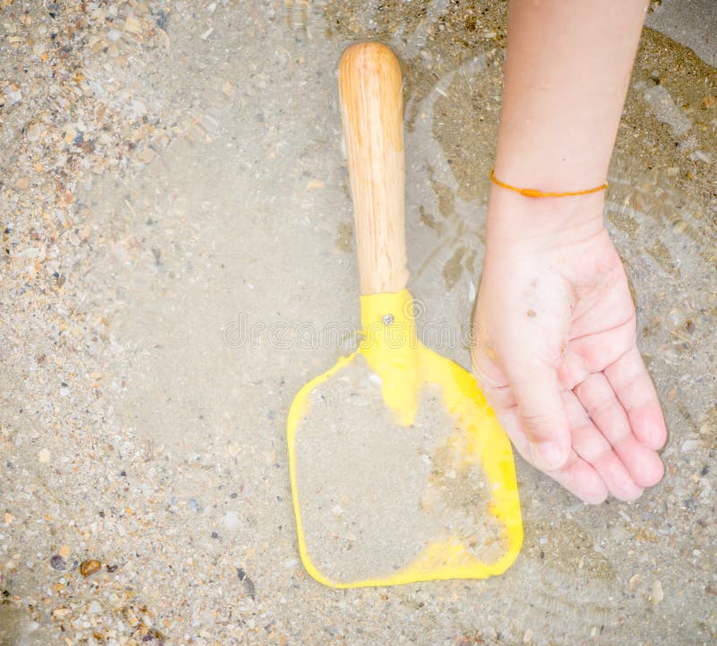 Kid Hand and Toy Shovel on Sand Sea Water Stock Photo Image of