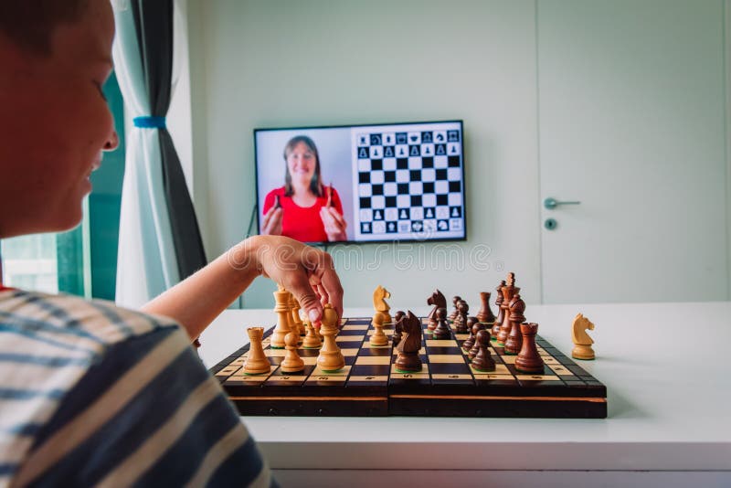 Teenage boy learning to play chess online with tablet computer. Online  education, remote distance learning, entertainment at home Stock Photo -  Alamy