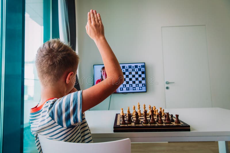 Brilliant Little Boy Playing Chess with His Chess Master, Uses Laptop for  Video Call. Remote Online Education, E-Education, Distance Learning Stock  Photo - Alamy