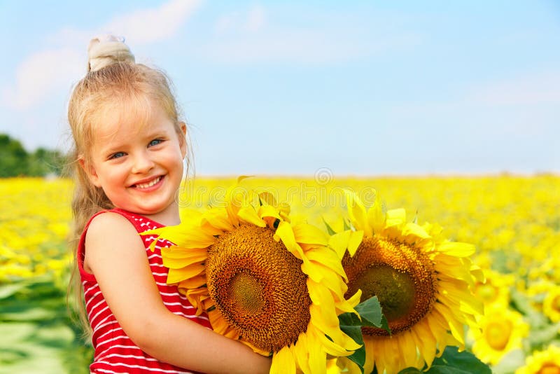 Kid Holding Sunflower Outdoor. Stock Photo Image of beauty, people