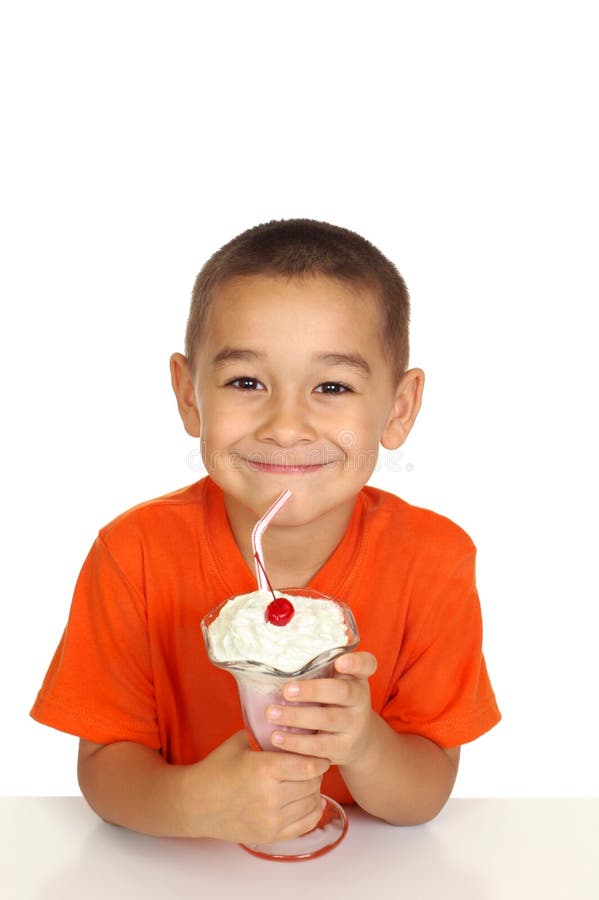 Kid with ice cream milk shake stock image