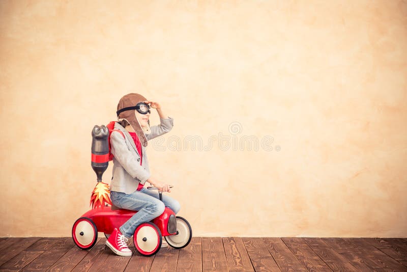 Kid with jet pack playing at home
