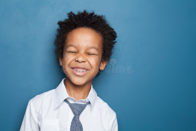 Kid Laughing. Black Child Boy Having Fun on Blue Background Stock Image