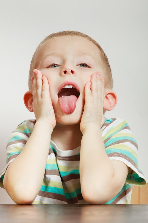 Kid making funny faces being bored