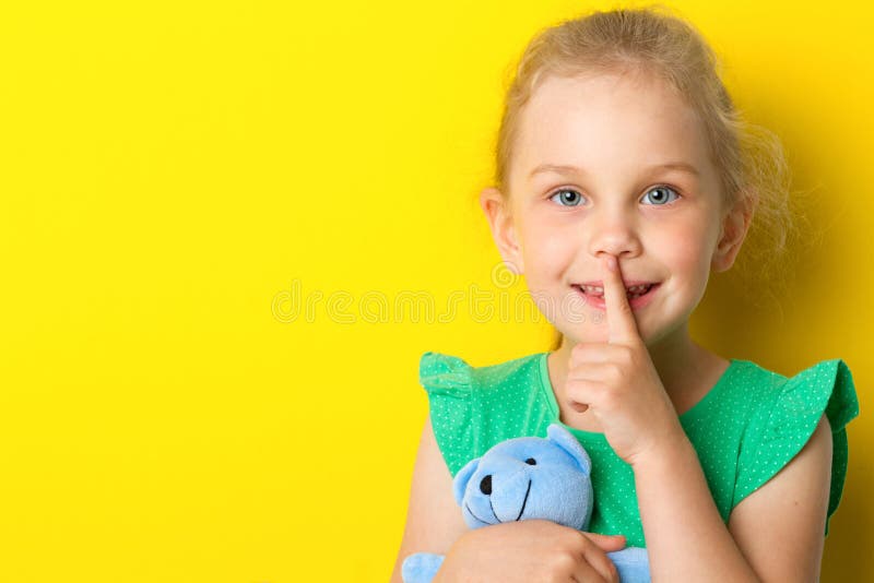 Kid making silence gesture stock image. Image of fashion 117873313