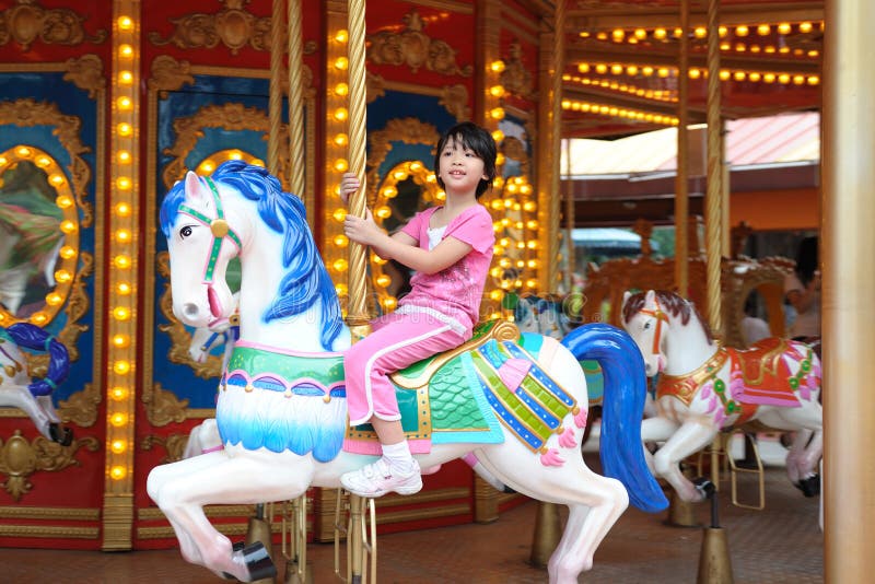 Kid in Merry go Round royalty free stock photography