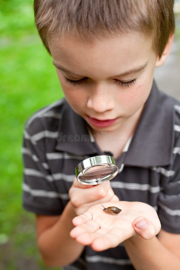 Kid observing snail