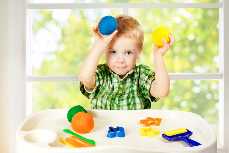Kid Play Modeling Plasticine, Child and Colorful Clay Dough, Toys stock photography Kid Play Modeling Plasticine, Child and Colorful Clay Dough, Toys stock photography