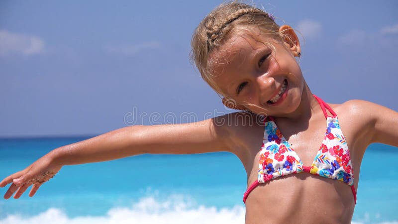 Kid Playing on Beach in Sunset, Child Face Watching Sea Waves, Girl Portrait on Shore, Ocean View