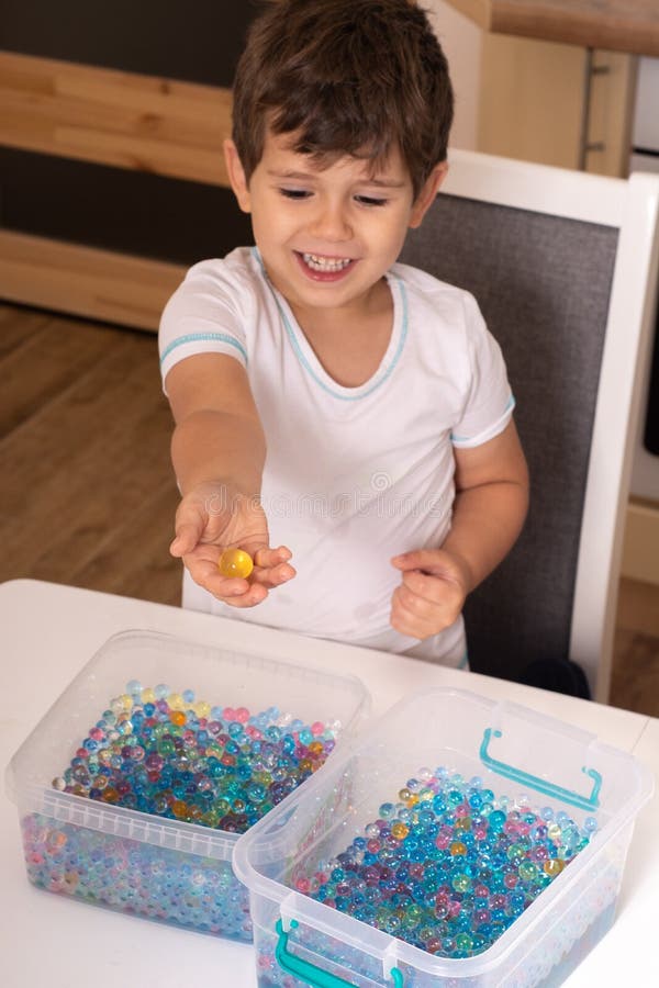 Kid Playing Orbeez Orbeez Balls Sensory Water Beads Stock Photo by  ©textandphoto 312762320