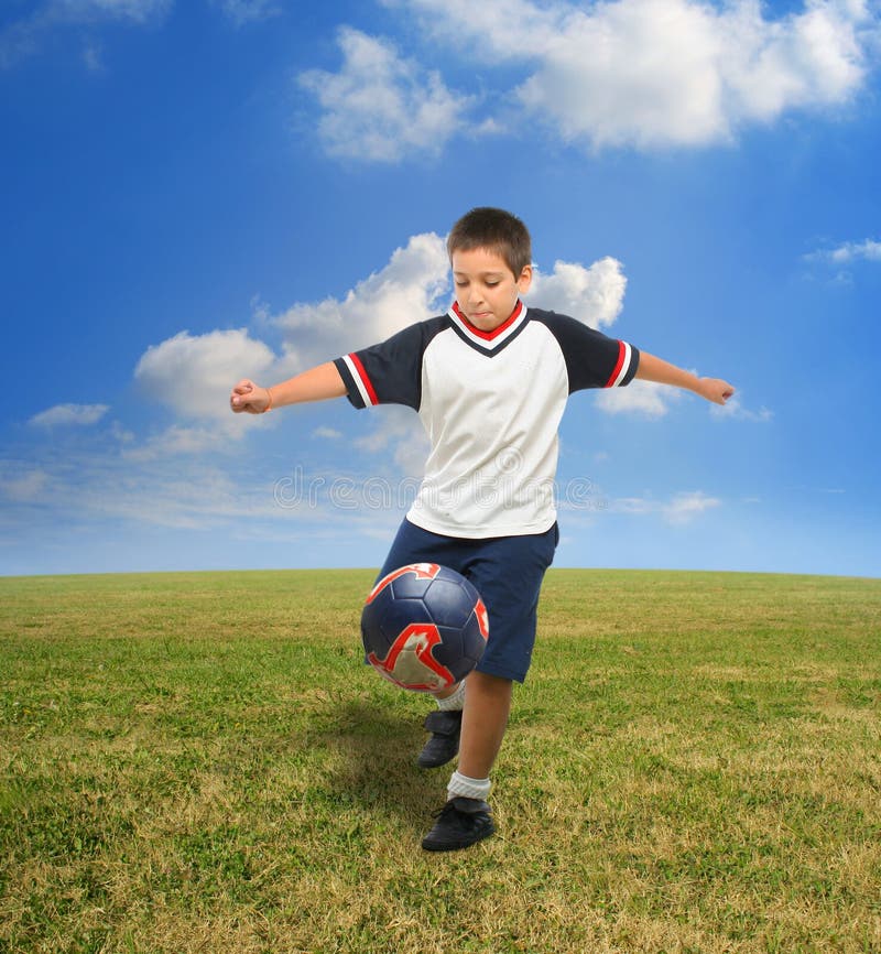 Kid playing soccer outside stock image. Image of game, field 822579