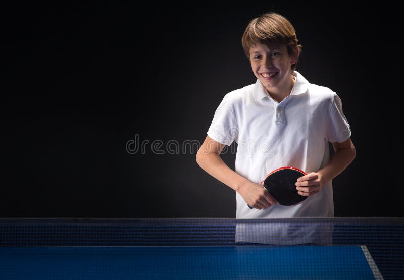 Kid playing table tennis stock photo. Image of indoors 84332976