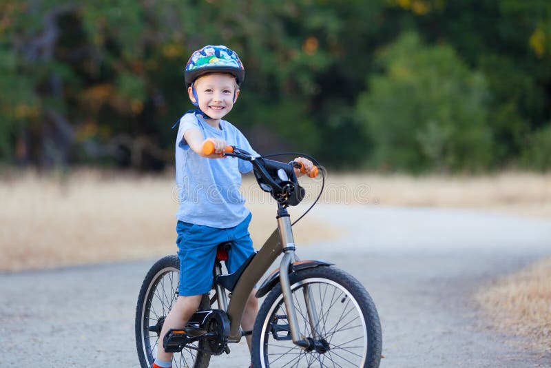 Kid riding bicycle stock photo. Image of male, caucasian 42491820