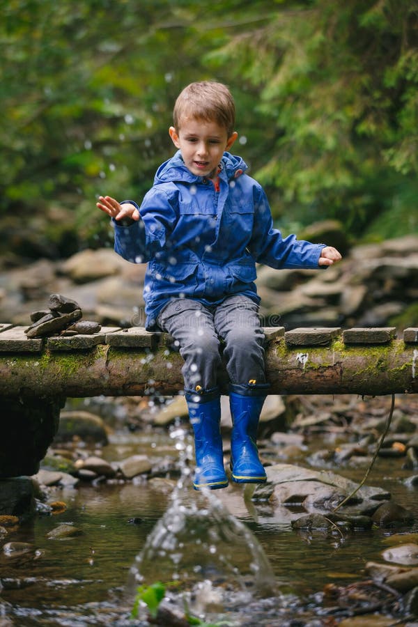 Kid s adventures in forest stock image. Image of river - 63613991