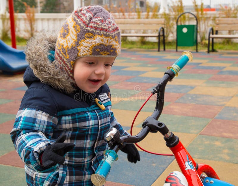 The Kid Saw the Bicycle at a Playground, he is Surprised and Adm Stock Image Image of laughing