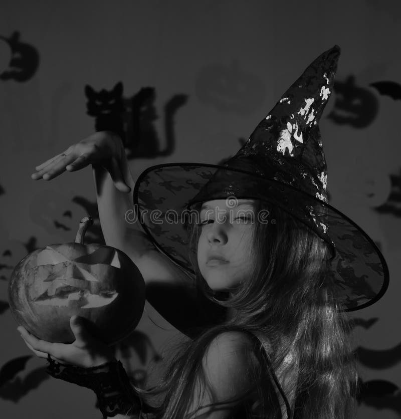 Kid in Spooky Witches Costume Holds Jack O Lantern. Stock Image - Image ...