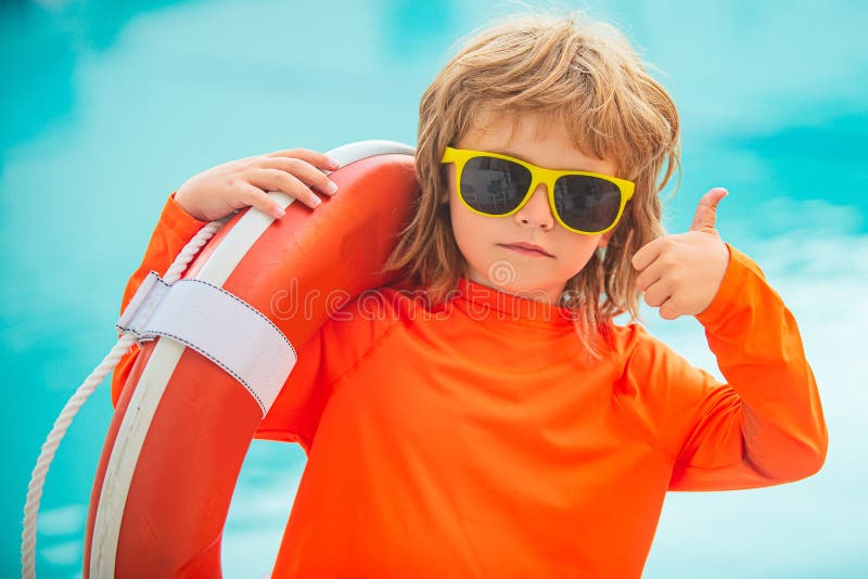 Kid in Sunglasses on Beach. Child Boy Lifeguard Show Thumbs Up