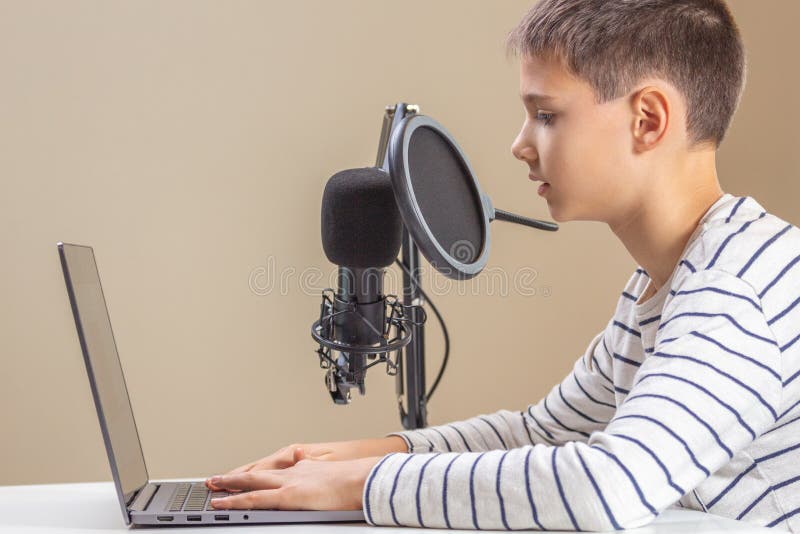 Kid with Laptop Computer Talking into Microphone. Techology, Online