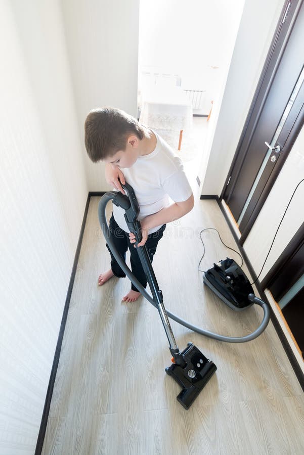 Kid Using Vacuum Cleaner In House Stock Photo Image of background