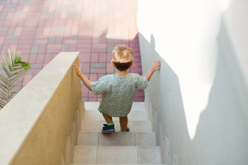 Kid walking down stairs stock photo. Image of staircase - 42391656